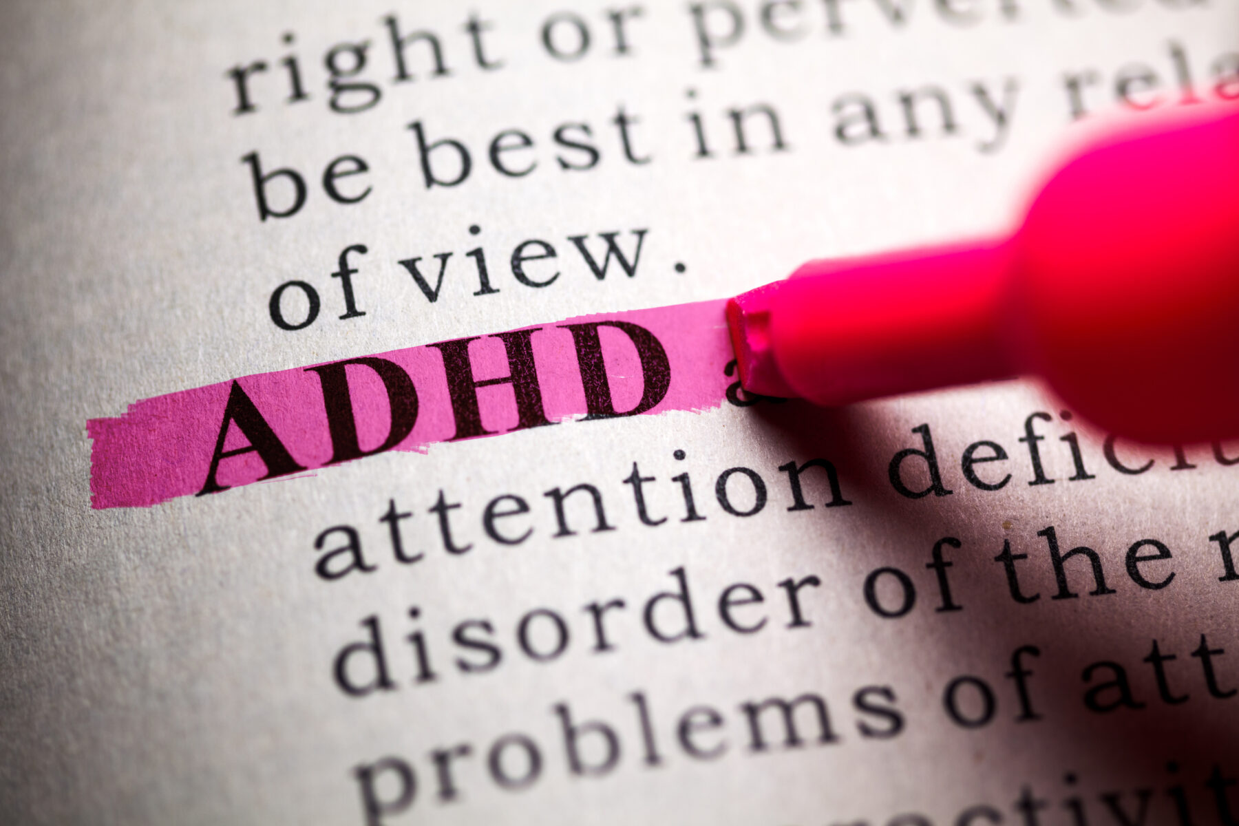 Dictionary with highlighter coloring the word ADHD